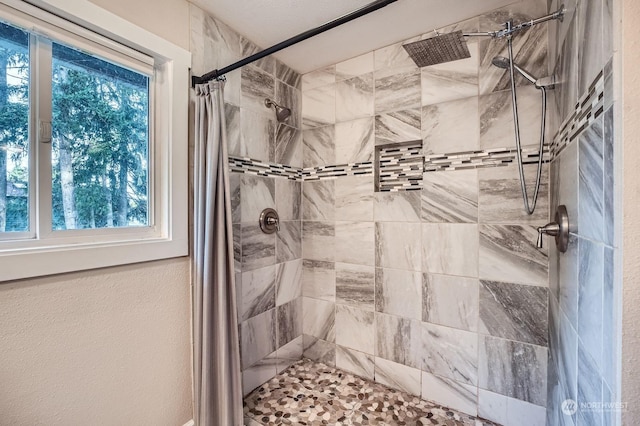 bathroom featuring curtained shower