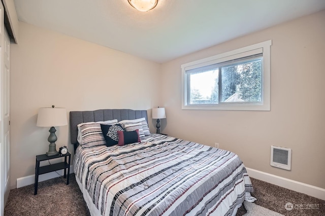 bedroom featuring dark carpet