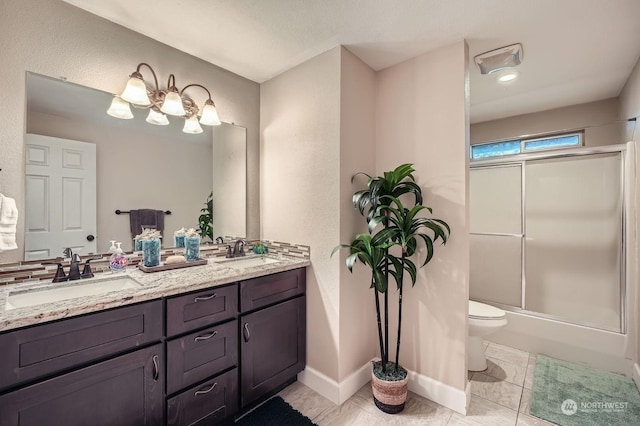 full bathroom with vanity, toilet, and enclosed tub / shower combo