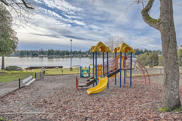 view of play area with a water view