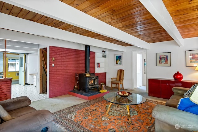 living room featuring wood ceiling, beam ceiling, and a wood stove