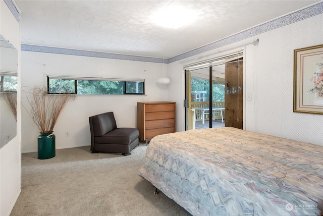 bedroom with multiple windows, access to outside, and light colored carpet