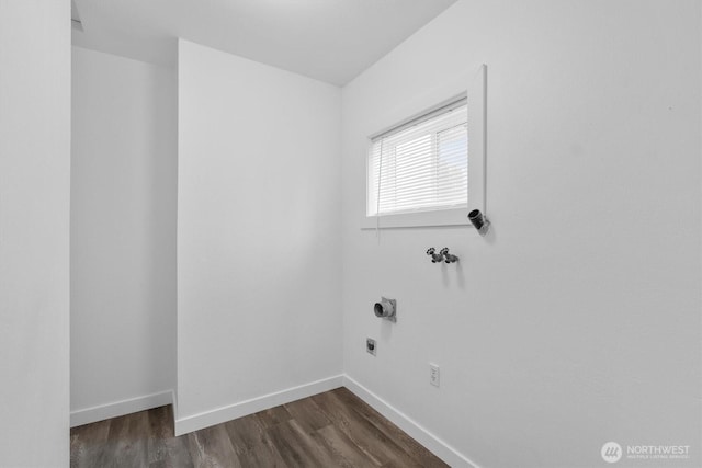 laundry area featuring hookup for a washing machine, laundry area, dark wood-style flooring, baseboards, and electric dryer hookup