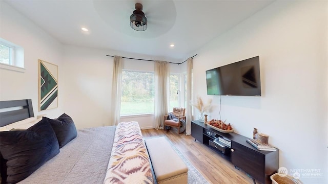 bedroom featuring ceiling fan and light hardwood / wood-style floors