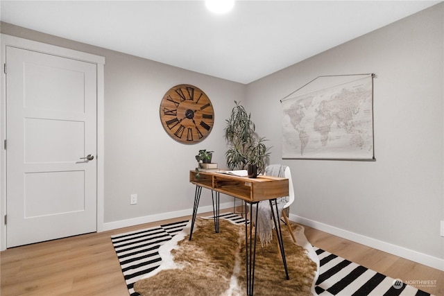 office space with light hardwood / wood-style floors