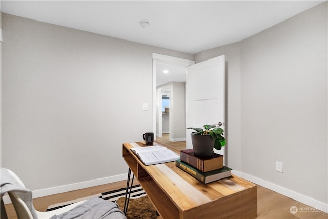 home office featuring hardwood / wood-style floors