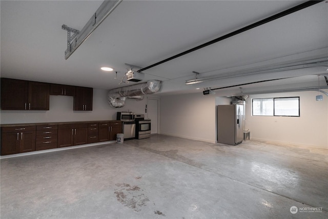 garage featuring stainless steel refrigerator with ice dispenser and a garage door opener