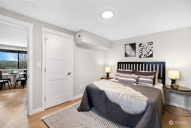 bedroom featuring light wood-type flooring