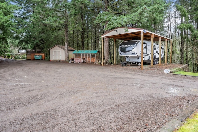 exterior space featuring a shed and a carport