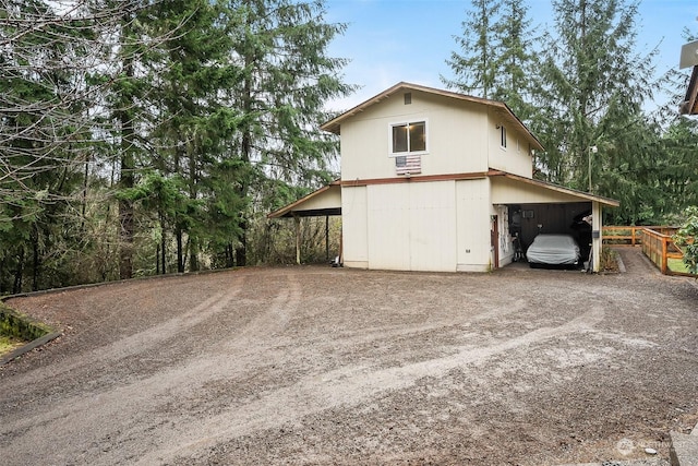 view of property exterior with a carport