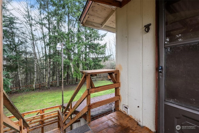 wooden deck with a yard