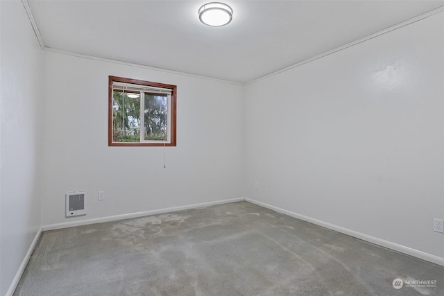 unfurnished room with carpet and ornamental molding