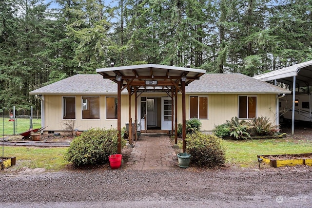 view of front of home featuring a carport