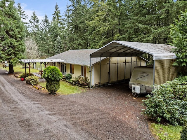 view of front of property featuring a carport