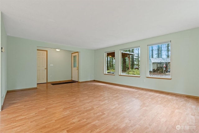 empty room with light hardwood / wood-style floors