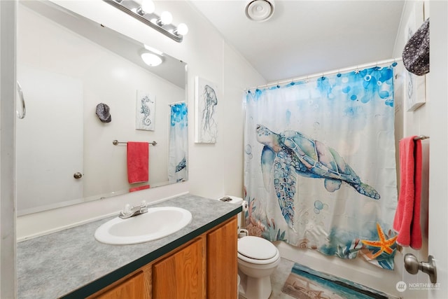 full bathroom with vanity, shower / bath combo, and toilet