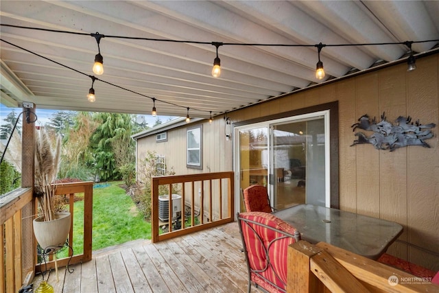 wooden terrace featuring cooling unit