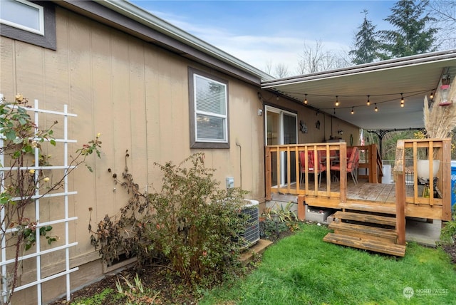 view of home's exterior featuring a wooden deck