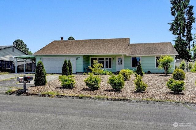 single story home featuring a garage and a carport