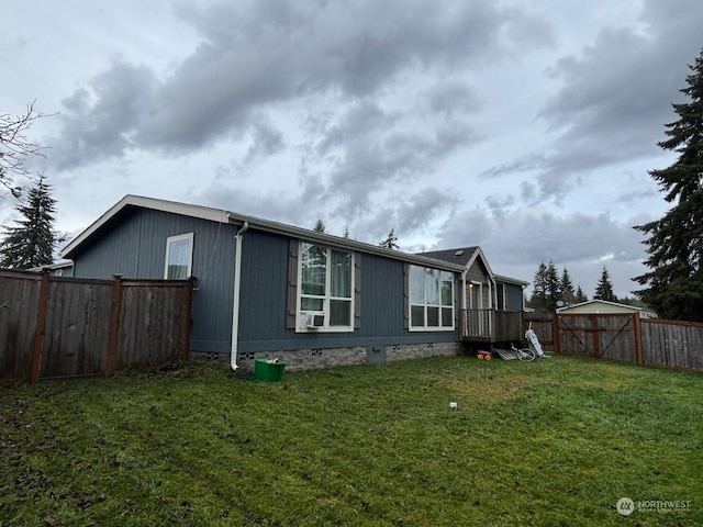 view of side of home with a lawn