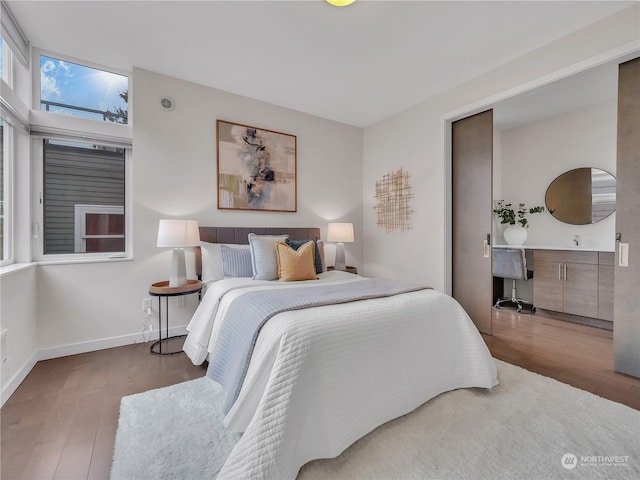 bedroom with hardwood / wood-style flooring