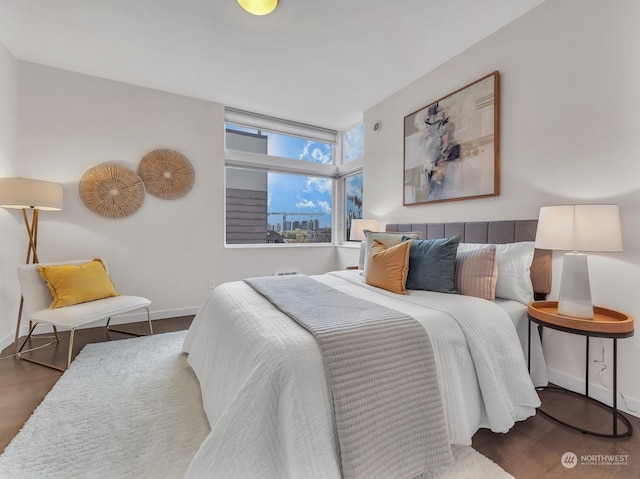 bedroom featuring dark wood-type flooring