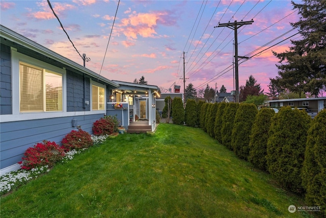 view of yard at dusk