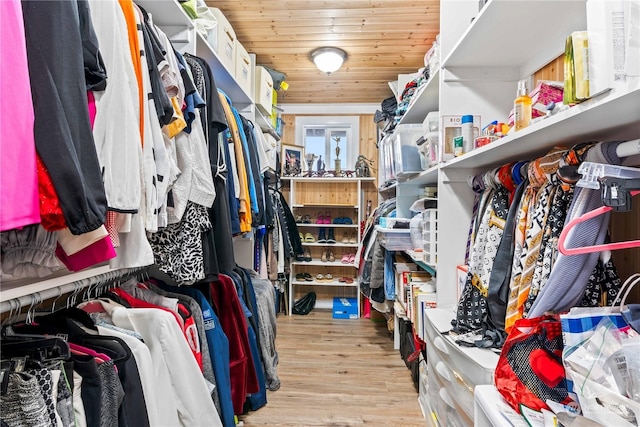 walk in closet with light wood-type flooring