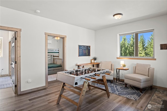 game room with dark hardwood / wood-style floors