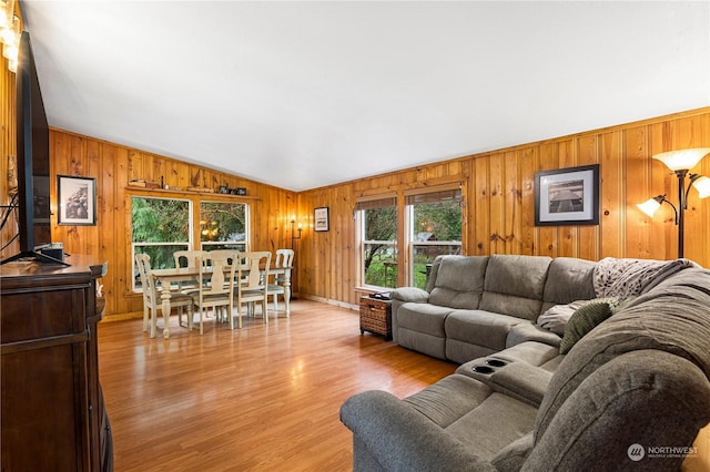 living room featuring light hardwood / wood-style flooring and lofted ceiling