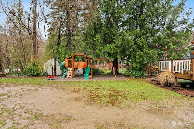 view of jungle gym featuring a deck