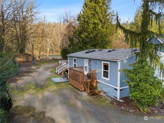 view of front of property with a wooden deck