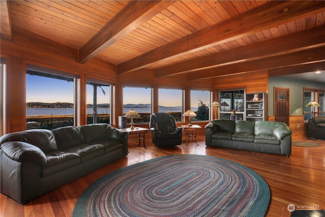 living room featuring wood ceiling, a water view, beam ceiling, and hardwood / wood-style floors