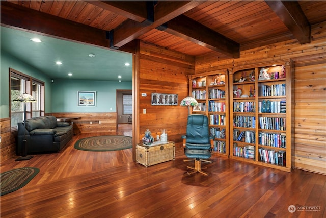 sitting room featuring wood ceiling, hardwood / wood-style flooring, and wooden walls