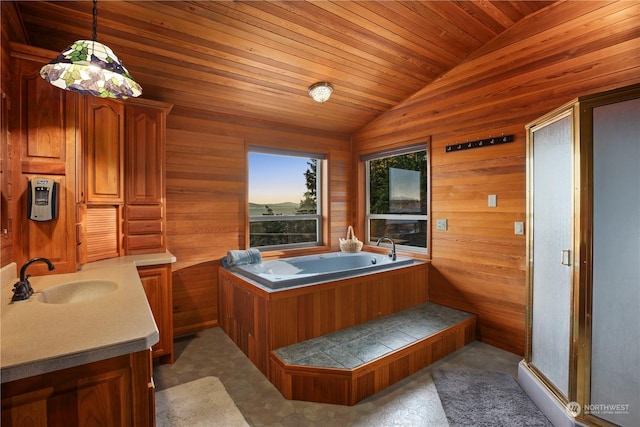 bathroom featuring wood ceiling, wooden walls, a washtub, vanity, and vaulted ceiling