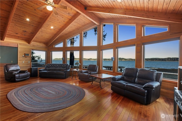 living room with wooden ceiling, hardwood / wood-style flooring, a water view, high vaulted ceiling, and beam ceiling