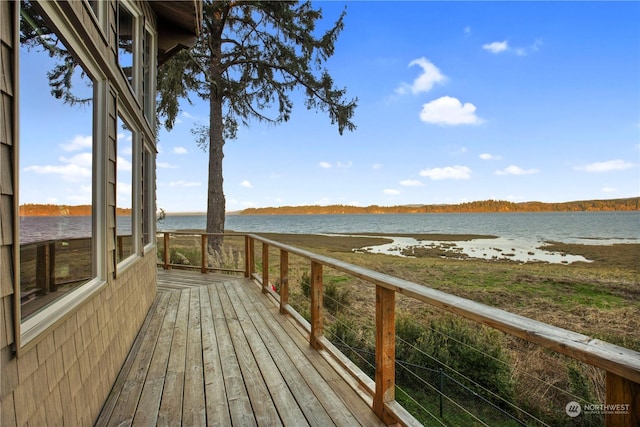 wooden terrace with a water view