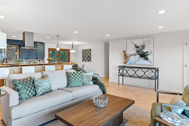 living room featuring baseboards, a baseboard radiator, and recessed lighting