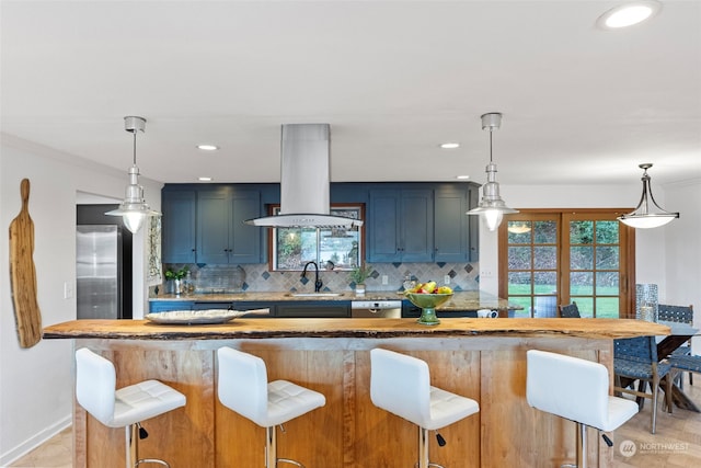 kitchen featuring tasteful backsplash, appliances with stainless steel finishes, island exhaust hood, and blue cabinets