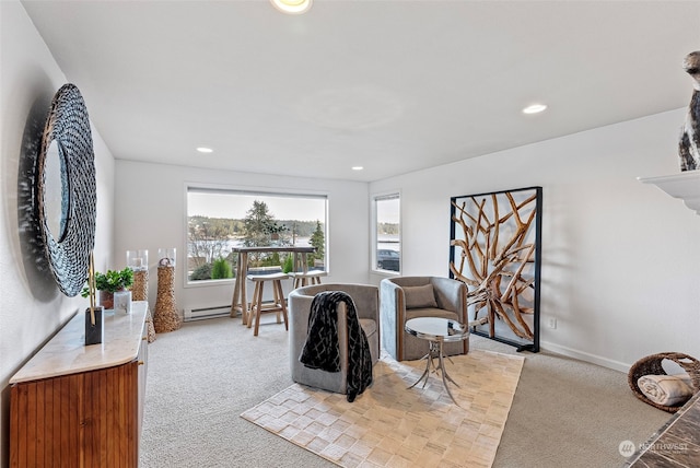 sitting room with light carpet, baseboards, and recessed lighting