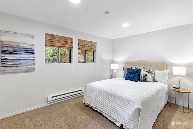 carpeted bedroom featuring a baseboard heating unit, recessed lighting, and baseboards