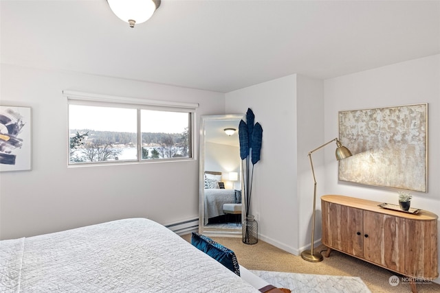 bedroom with carpet, a baseboard radiator, and baseboards