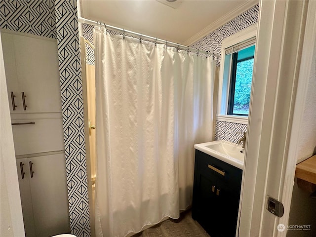 full bath with a shower with curtain, wallpapered walls, crown molding, and vanity