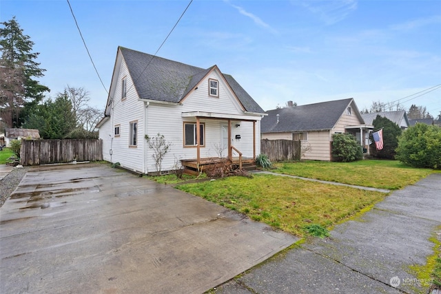 bungalow-style home featuring a front yard