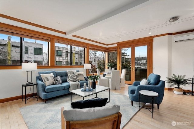 sunroom featuring an AC wall unit, a wealth of natural light, and beam ceiling