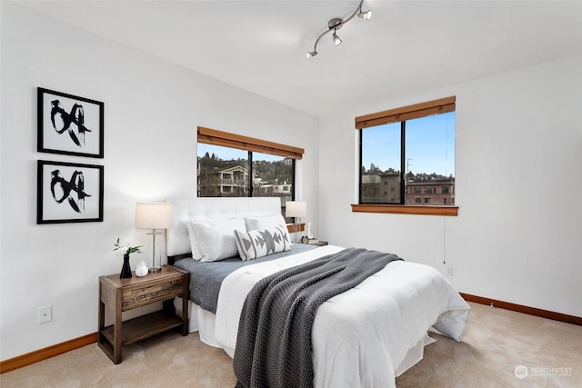 bedroom with light colored carpet