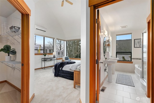 interior space featuring multiple windows, light colored carpet, an AC wall unit, and lofted ceiling