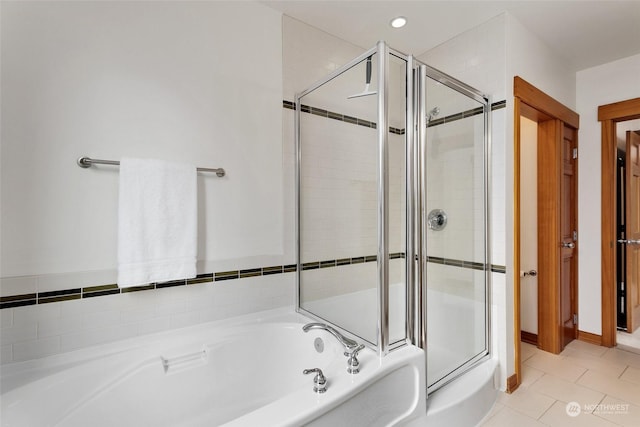 bathroom featuring separate shower and tub and tile patterned flooring