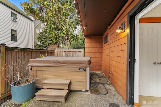 view of patio with a hot tub