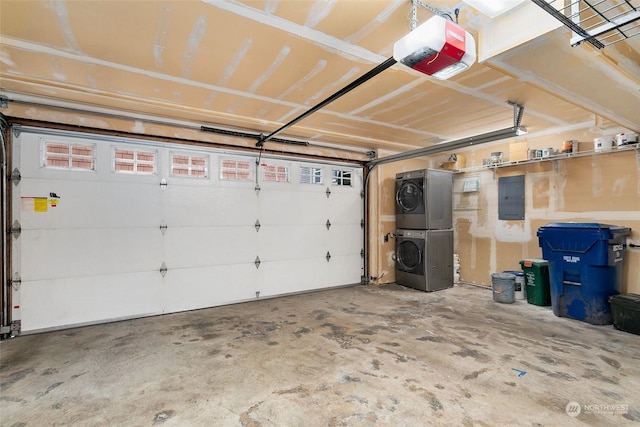 garage with stacked washer and dryer, a garage door opener, and electric panel